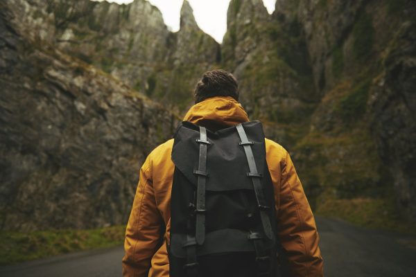 man hiking in hills